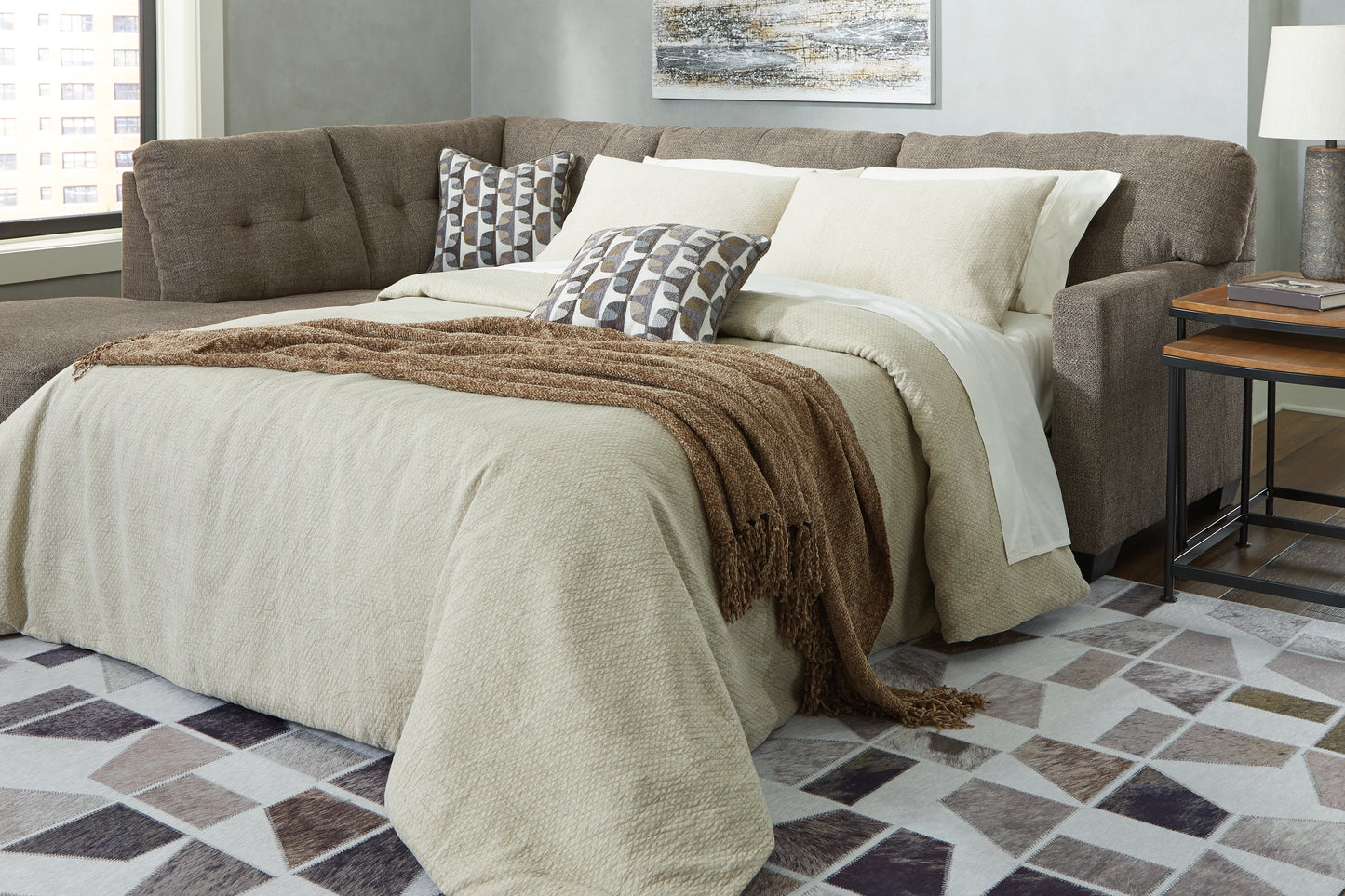 Cape Furniture Outlet - Ashley Furniture - Mahoney Sectional - RAF 2-Piece Sleeper Sectional with Chaise / Chocolate - 31005S3