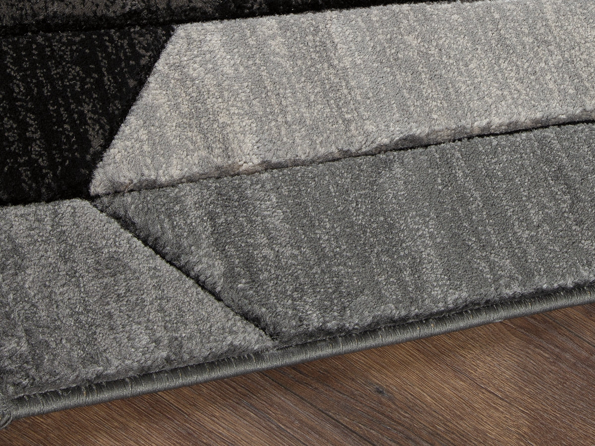 Cape Furniture Outlet - Ashley Furniture - Chayse Rug - 6'6" x 9'6" Rug / Black/Gray - R403461