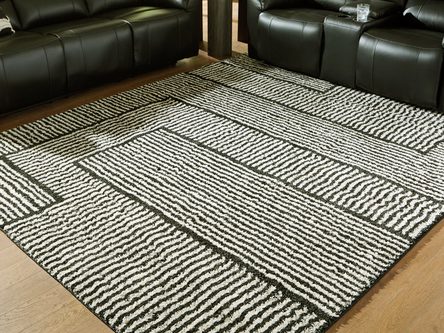 Cape Furniture Outlet - Ashley Furniture - Kurtmen Rug - 7'10" x 9'10" Area Rug / Black/Ivory - R407591