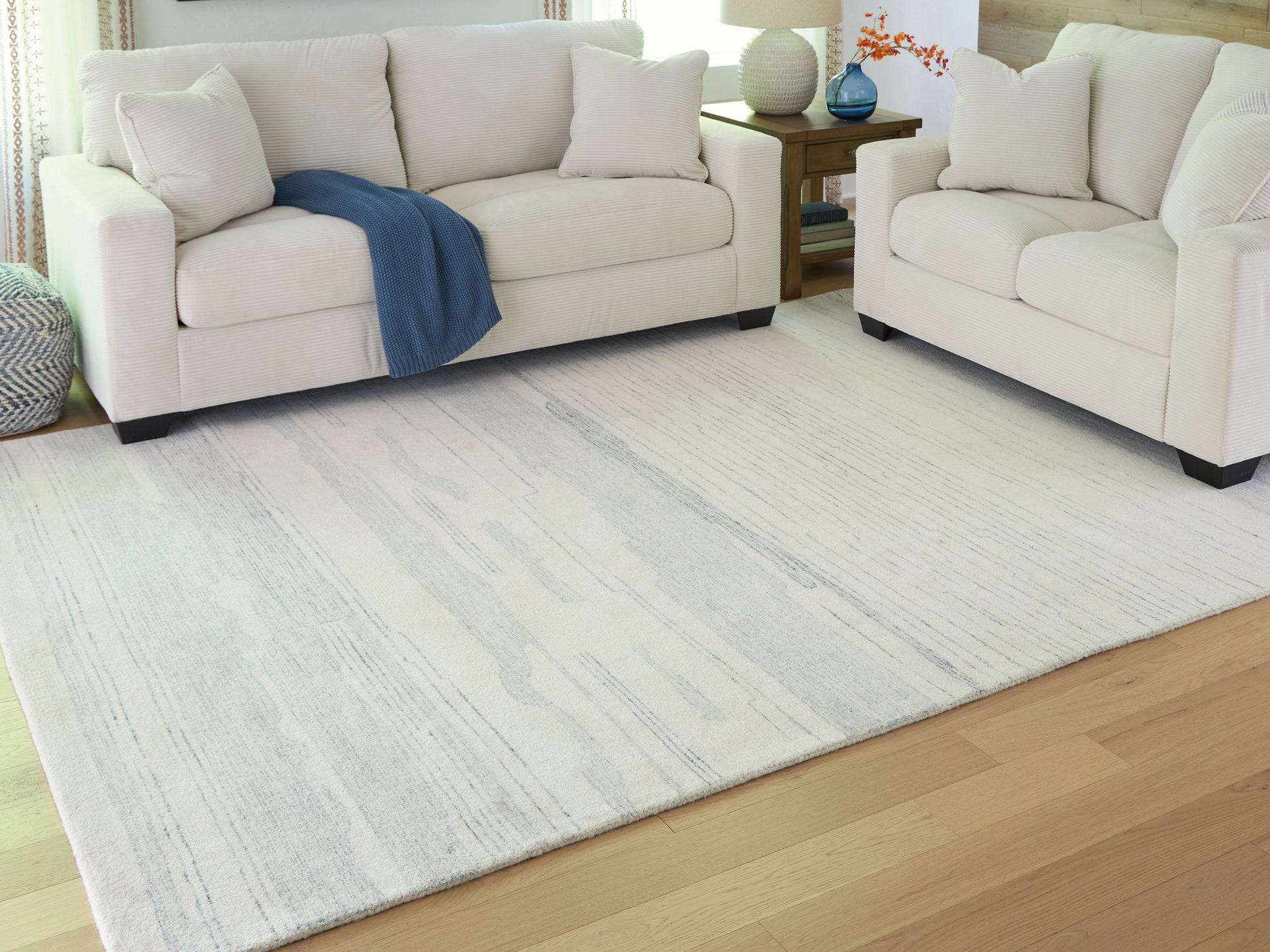 Cape Furniture Outlet - Ashley Furniture - Genemost Rug - 5' x 7' Area Rug / Ivory/Blue - R407842