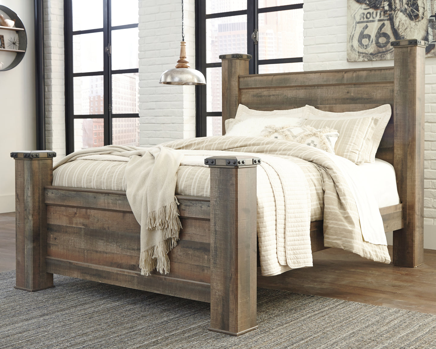 Cape Furniture Outlet - Ashley Furniture - Trinell Bedroom - Queen Poster Bed / Brown - B446B40