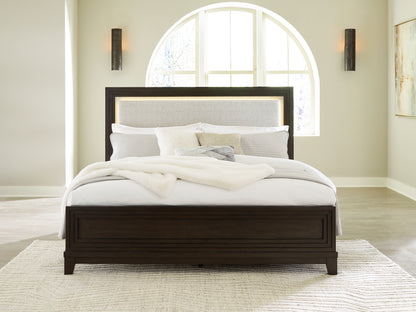 Cape Furniture Outlet - Ashley Furniture - Neymorton Bedroom - King Upholstered Panel Bed / Dark Grayish Brown - B618B4