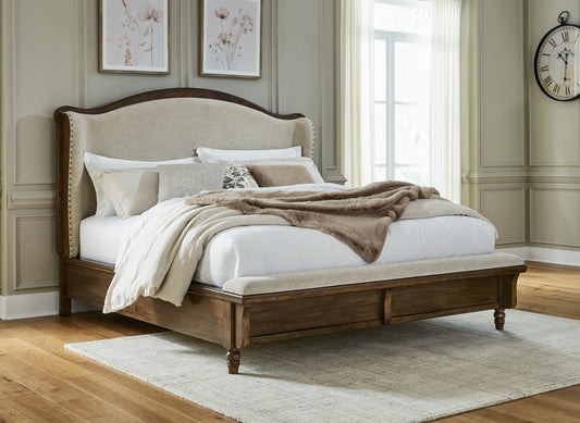 Cape Furniture Outlet - Ashley Furniture - Sturlayne Bedroom - California King Upholstered Panel Bed / Brown - B787B5