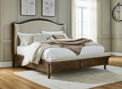 Cape Furniture Outlet - Ashley Furniture - Sturlayne Bedroom - California King Upholstered Panel Bed / Brown - B787B5