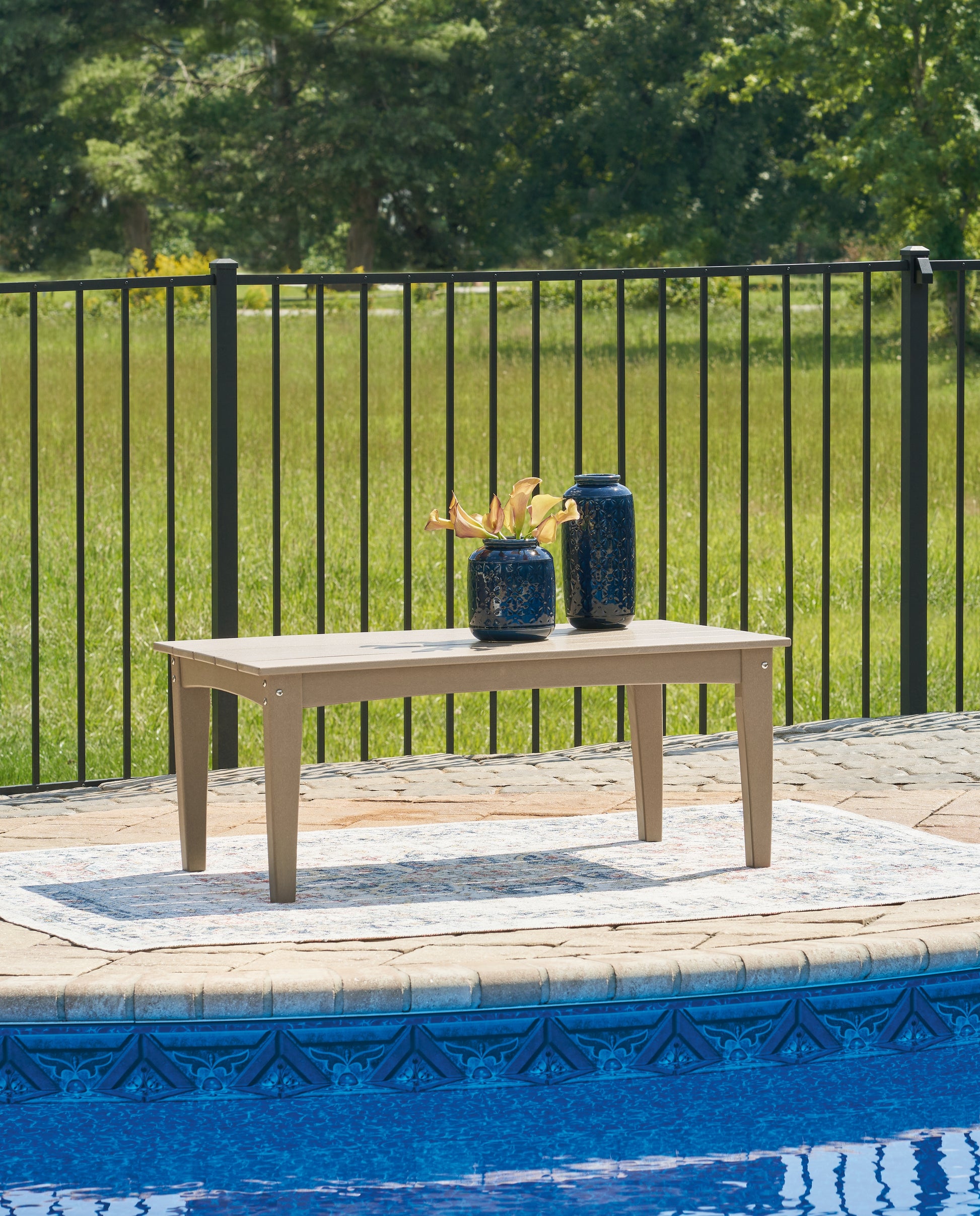 Cape Furniture Outlet - Ashley Furniture - Hyland wave Outdoor - Rectangular Cocktail Table / Driftwood - P114-701