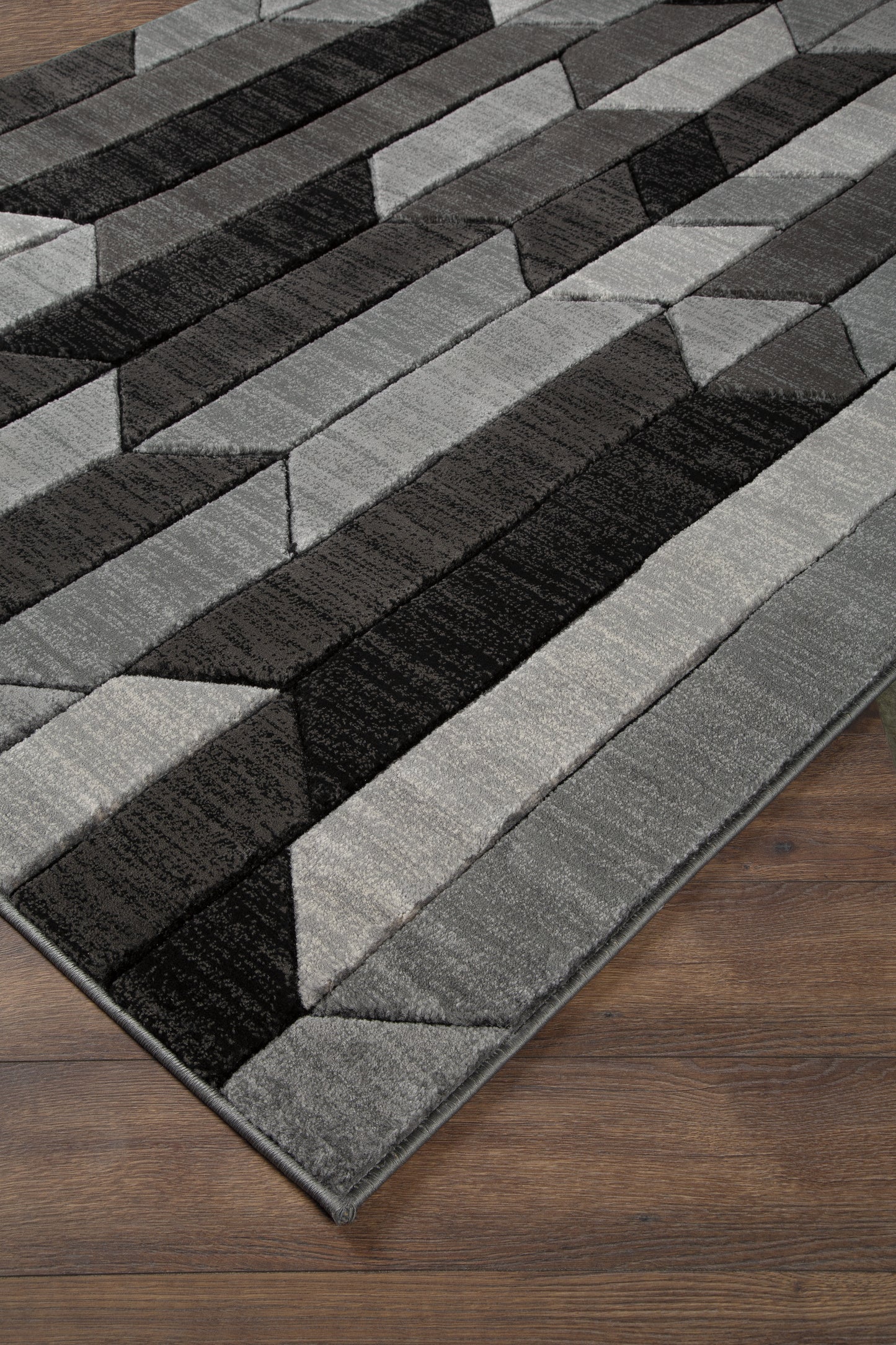 Cape Furniture Outlet - Ashley Furniture - Chayse Rug - 6'6" x 9'6" Rug / Black/Gray - R403461