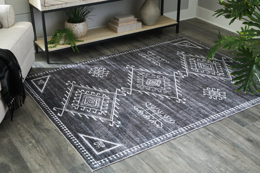 Cape Furniture Outlet - Ashley Furniture - Arloman Rug - 5' x 7' Washable Rug / Black/Cream/Gray - R405932