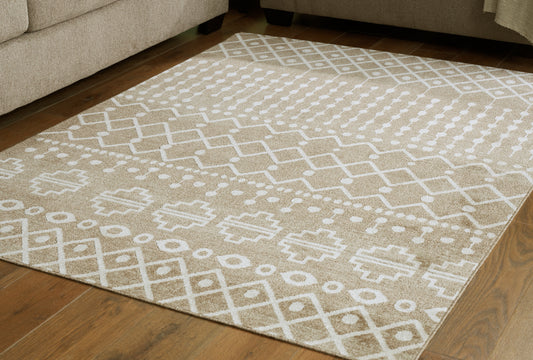 Cape Furniture Outlet - Ashley Furniture - Bunchly Rug - 7'10" x 10'3" Washable Rug / Tan/Brown/Cream - R406221