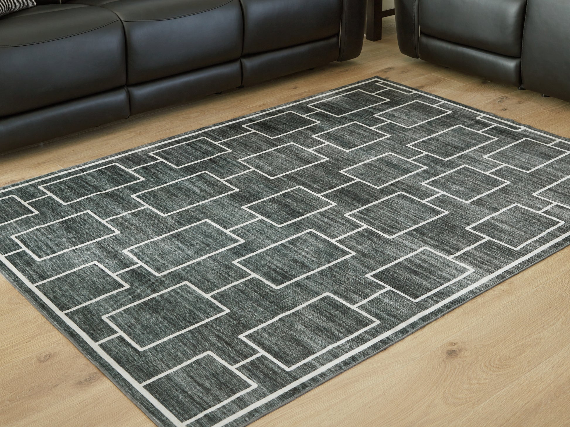 Cape Furniture Outlet - Ashley Furniture - Elderland Rug - Washable 5' x 7' Area Rug / Black/Gray - R407402
