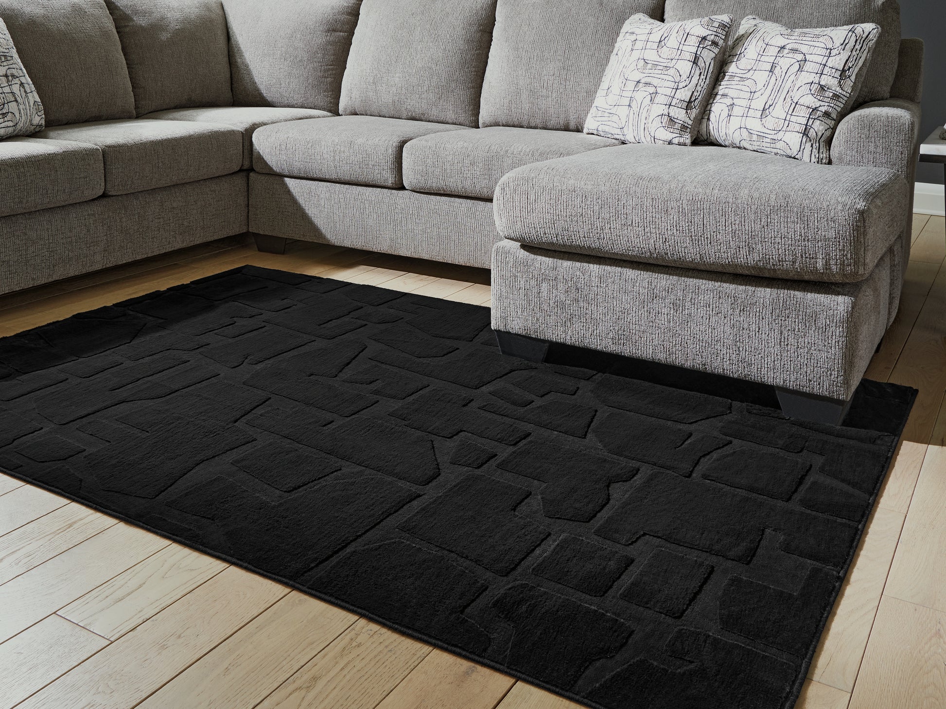 Cape Furniture Outlet - Ashley Furniture - Gibbswell Rug - Washable 5' x 7' Area Rug / Black - R407462