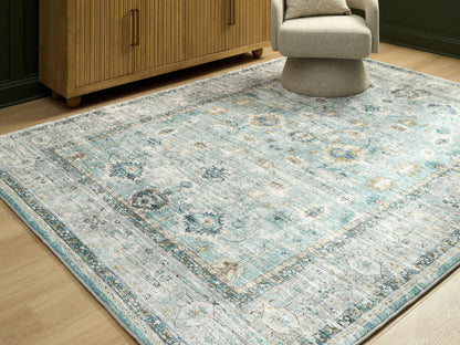 Cape Furniture Outlet - Ashley Furniture - Ladstoney Rug - 7'6" x 9'6" Area Rug / Teal/Beige/Ochre - R407501