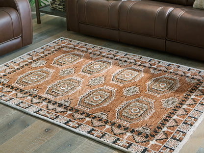 Cape Furniture Outlet - Ashley Furniture - Qaabiz Rug - 5' x 7' Area Rug / Sienna/Ivory/Black - R407522