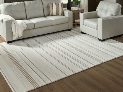 Cape Furniture Outlet - Ashley Furniture - Gadence Rug - 7'8" x 10' Area Rug / Ivory/Tan - R407641