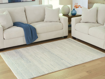 Cape Furniture Outlet - Ashley Furniture - Genemost Rug - 5' x 7' Area Rug / Ivory/Blue - R407842